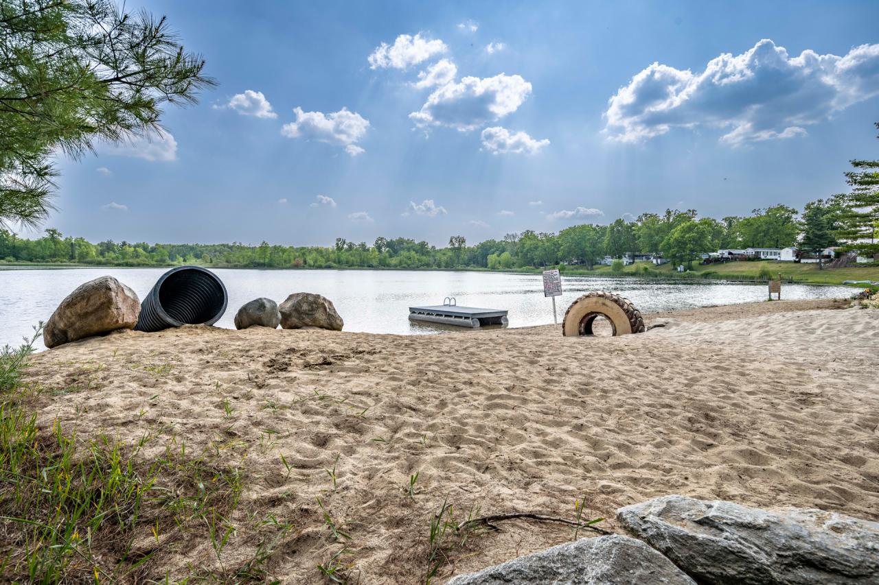 Sandy beach on our 35-acre spring-fed lake