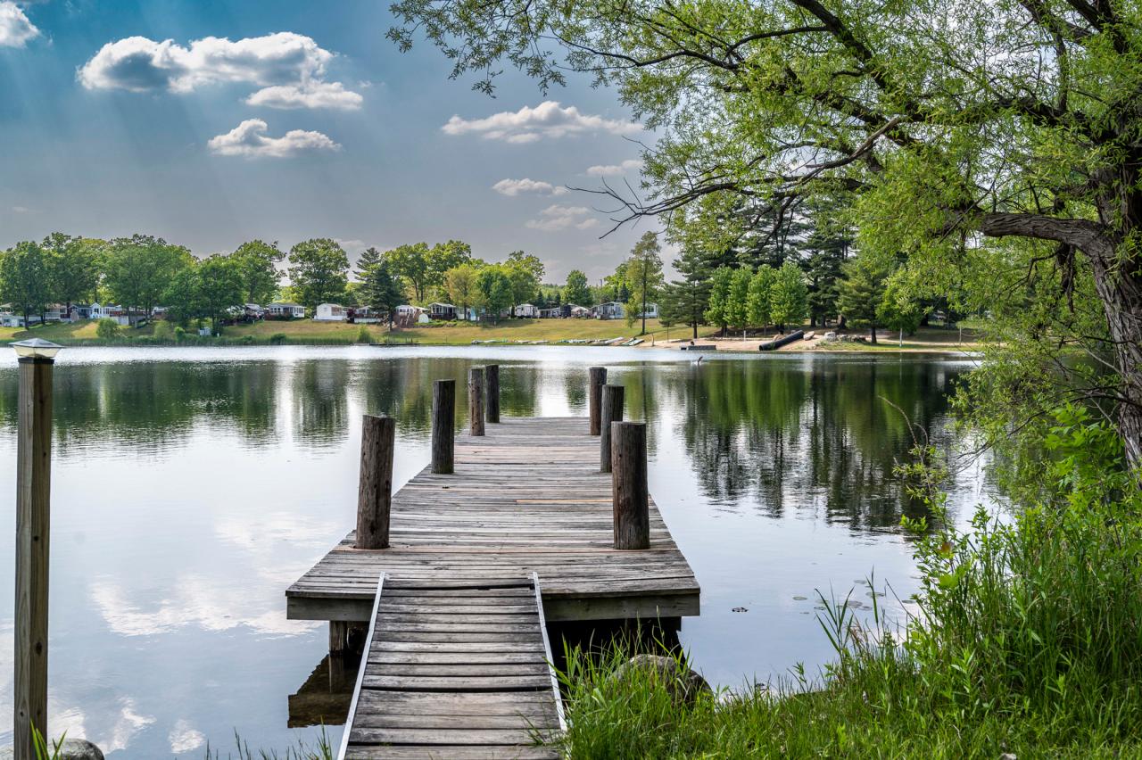 Dock stretching into the clear lake